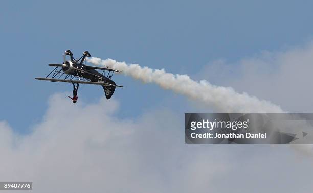 Pilot Kyle Frankin and wingwalker Todd Green perform during the Experimental Aircraft Association's 2009 AirVenture annual fly-in and convention on...