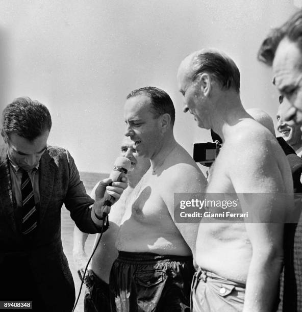 Palomaresm Almeria, Spain. The spanish minister Manuel Fraga bathes in the beach of Palomares with the U.S. Ambassador Angier Biddle Duke, because of...