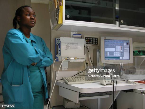 Houston, Texas, United States. Texas Medical Center. In the image a nurse next to a computer and sanitary material.