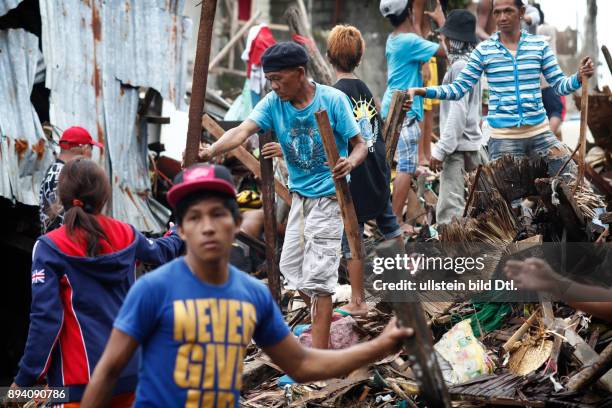 Typhoon Haiyan leaves a trail of destruction and death in Tacloban. Almost three weeks after the disaster thousands of bodies stil need to be...