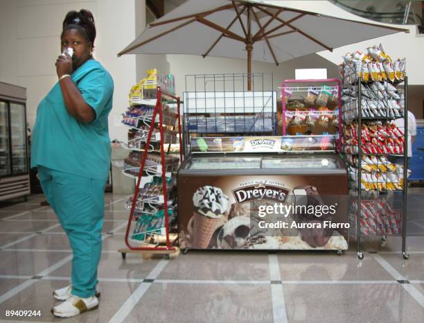 Houston, Texas, United States. Texas Medical Center. In the image a together nurse eating a position of food.