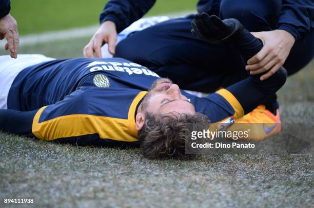 Alessio Cerci of Hellas Verona is stretchered off the pitch during the Serie A match between Hellas Verona FC and AC Milan at Stadio Marc'Antonio...