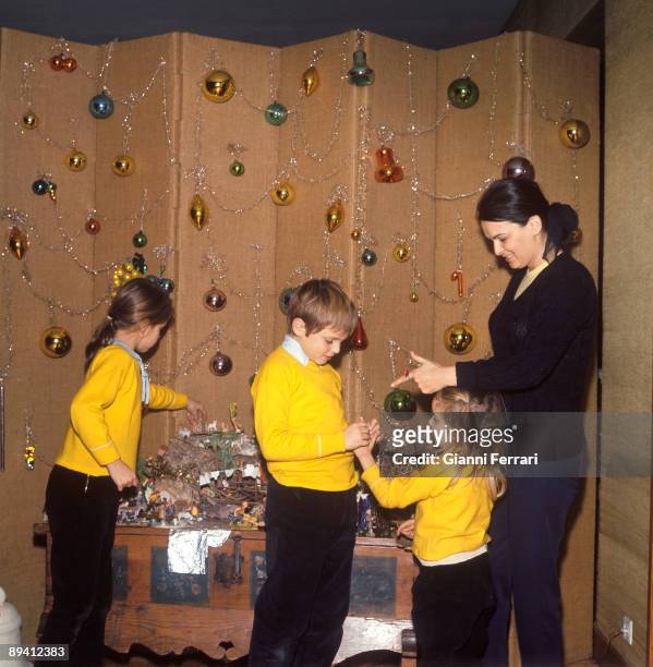 Madrid , Spain. The actress Lucia Bose prepares the Christmas decoration with her children Lucia, Miguel and Paola in her house of Somosaguas.