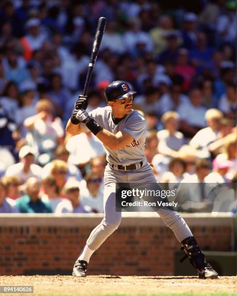 Benito Santiago of the San Diego Padres bats during an MLB game at Wrigley Field in Chicago, Illinois during the 1990 season.