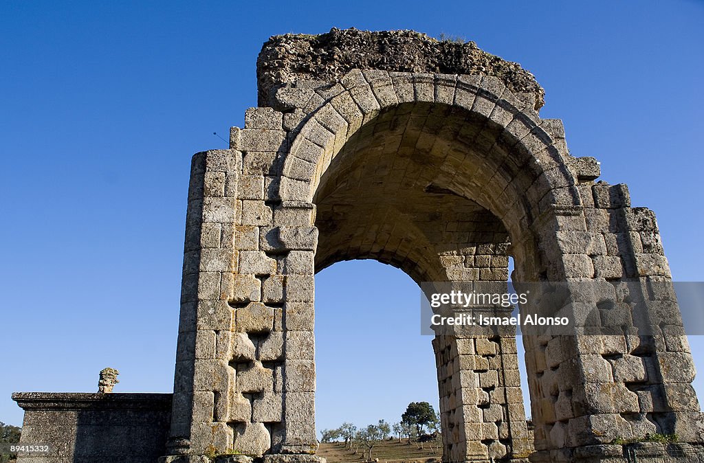 Arch (1st century A.D.) Caparra ruins. Ancient spanish Roman city.