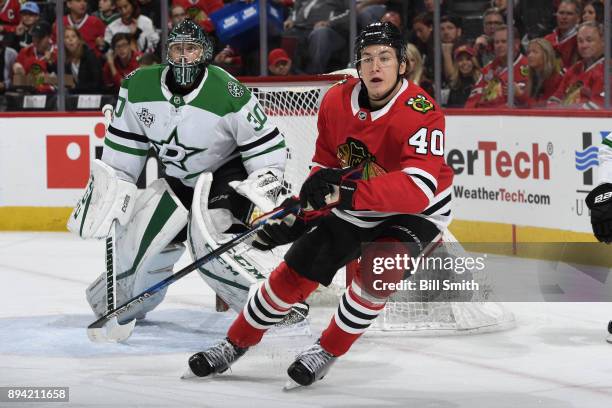 John Hayden of the Chicago Blackhawks skates in front of goalie Ben Bishop of the Dallas Stars in the first period at the United Center on November...