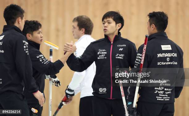 Team Karuizawa players celebrate winning the semi final during day four of the Karuizawa International Curling Championships at the Karuizawa Ice...
