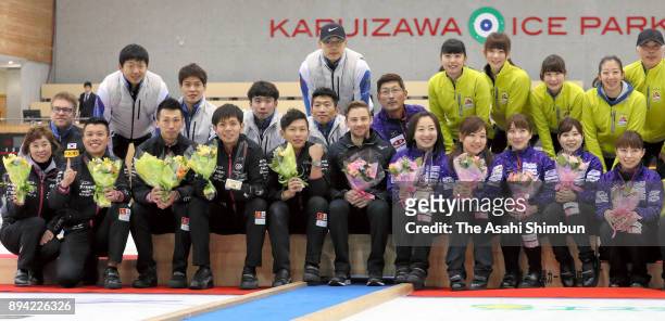 Women's champions LS Kitami and Men's champions Team Karuizawa pose for photographs during day four of the Karuizawa International Curling...