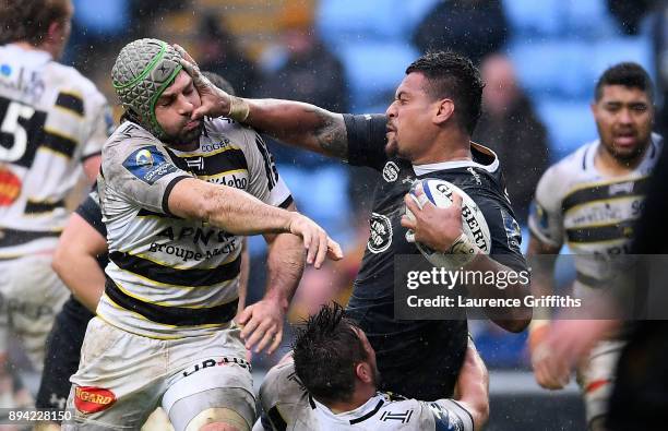 Nathan Hughes of Wasps hands off the tackle of Kevin Gourdon of La Rochelle during the European Rugby Champions Cup match between Wasps and La...