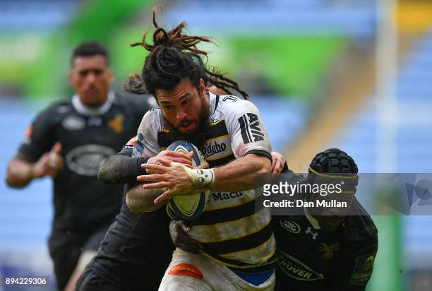 Rene Ranger of La Rochelle is tackled by Danny Cipriani and Christian Wade of Wasps during the European Rugby Champions Cup match between Wasps and...