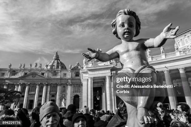 Children and faithfuls have figurines of baby Jesus blessed by Pope Francis during his Sunday Angelus prayer in St. Peter's Square on December 17,...