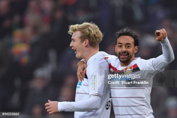Julian Brandt of Bayer Leverkusen celebrates with Karim Bellarabi of Bayer Leverkusen after scoring his team's first goal to make it 0-1 during the...