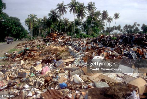 November, 2005. Aceh, Banda Aceh . Indonesia. Mountains of rubbles and remains of the Tsunami piled up next to the highway to the outskirts of Aceh...