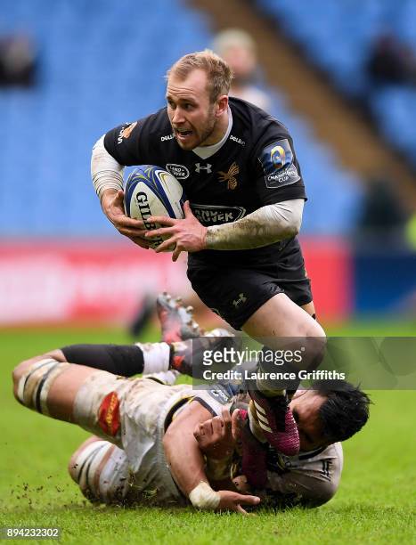 Dan Robson of Wasps is tackled by Victor Vito of La Rochelle during the European Rugby Champions Cup match between Wasps and La Rochelle at Ricoh...