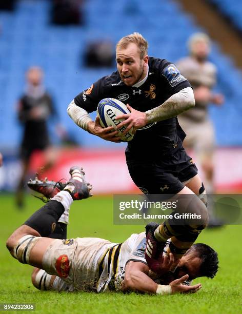 Dan Robson of Wasps is tackled by Victor Vito of La Rochelle during the European Rugby Champions Cup match between Wasps and La Rochelle at Ricoh...