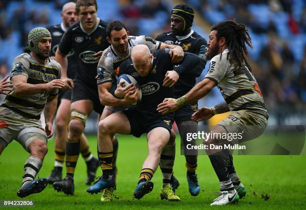 Joe Simpson of Wasps is tackled by Geoffrey Doumayrou and Rene Ranger of La Rochelle during the European Rugby Champions Cup match between Wasps and...