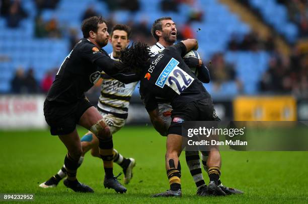 Brock James of La Rochelle is tackled by Kyle Eastmond of Wasps during the European Rugby Champions Cup match between Wasps and La Rochelle at Ricoh...