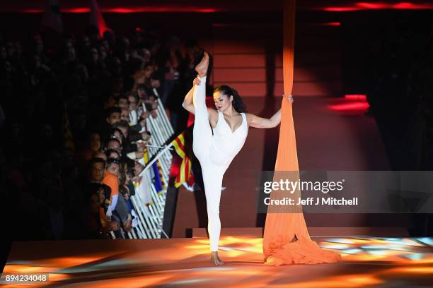 An acrobat performs during the Ciudadanos party's second rally of the weekend ahead of the forthcoming Catalan parliamentary election on December 17,...