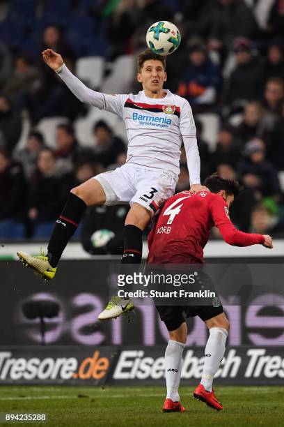 Panagiotis Retsos of Bayer Leverkusen and Julian Korb of Hannover 96 battle for the ball during the Bundesliga match between Hannover 96 and Bayer 04...