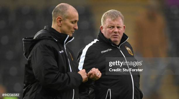 Saints Interim head coach Alan Dickens chats with Dorian West before the European Rugby Champions Cup match between Ospreys and Northampton Saints at...