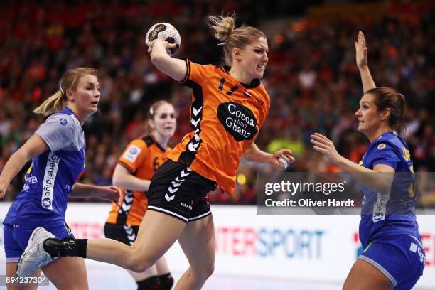 Nycke Groot of Netherlands and Isabelle Gullden and Sabina Jacobsen of Sweden challenges for the ball during the IHF Women's Handball World...