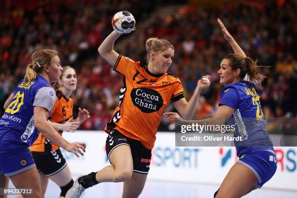 Nycke Groot of Netherlands and Isabelle Gullden and Sabina Jacobsen of Sweden challenges for the ball during the IHF Women's Handball World...