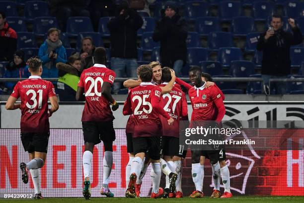 Felix Klaus of Hannover 96 celebrates with his team-mates after scoring his team's third goal to make it 3-2 during the Bundesliga match between...