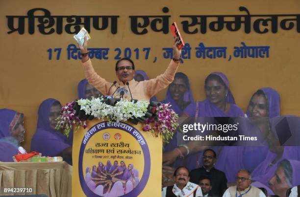 Vice President Venkaiah Naidu with Madhya Pradesh chief minister Shivraj Singh Chouhan during the Women Self-Help Group Convention, on December 17,...