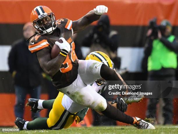 Running back Isaiah Crowell of the Cleveland Browns falls to the ground as he is tackled in overtime of a game on December 10, 2017 against the Green...