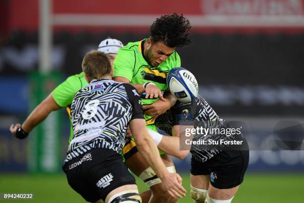 Saints player Lewis Ludlam is smashed into by the Ospreys defence during the European Rugby Champions Cup match between Ospreys and Northampton...