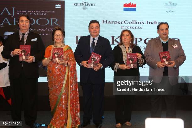 Bollywood actor Randhir Kapoor, author Ritu Nanda, actor Rishi Kapoor, Reema Jain and actor Rajiv Kapoor during the launch of author Ritu Nanda's...