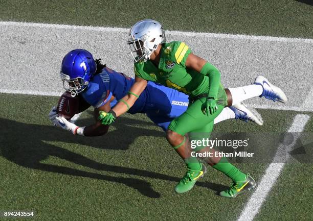 Wide receiver A.J. Richardson of the Boise State Broncos misses a pass under pressure from cornerback Thomas Graham Jr. #4 of the Oregon Ducks during...