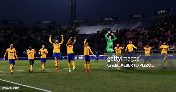 Juventus's players celebrate at the end of the Italian Serie A football match Bologna vs Juventus on December 17, 2017 at Renato Dall'Ara stadium in...