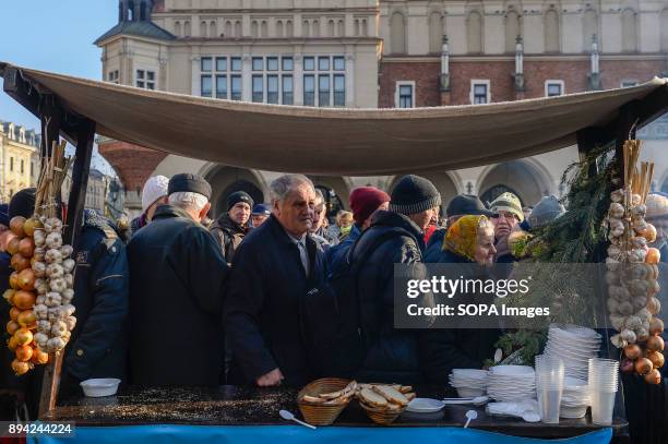 Hundreds of homeless and needy people seen queuing up as they take part in the 21st Edition of the Biggest Christmas table in Europe at the Main...