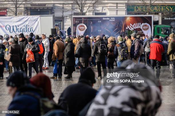 Hundreds of homeless and needy people seen queuing up as they take part in the 21st Edition of the Biggest Christmas table in Europe at the Main...
