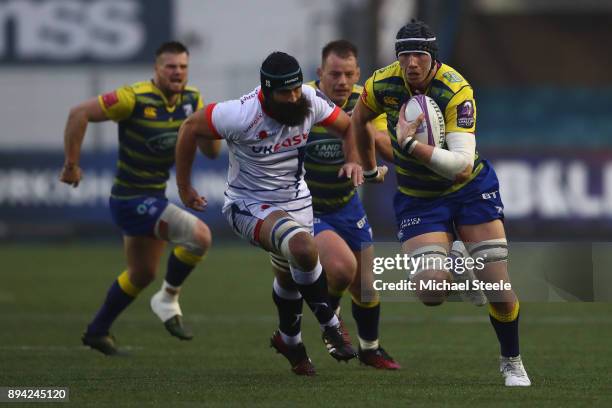 Seb Daies of Cardiff breaks clear of Josh Strauss of Sale during the European Rugby Challenge Cup Pool Two match between Cardiff Blues and Sale...