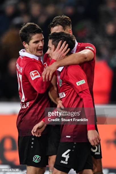Julian Korb of Hannover 96 celebrates with his team-mates after scoring a goal to make it 4-4 during the Bundesliga match between Hannover 96 and...