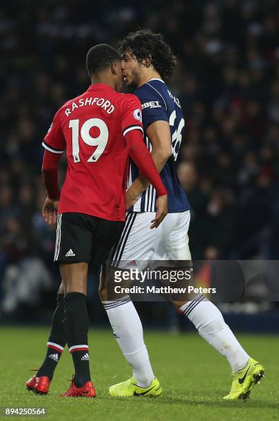 Marcus Rashford of Manchester United clashes with Ahmed Hegazi of West Bromwich Albion during the Premier League match between West Bromwich Albion...
