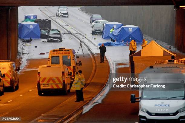 Police officers work at the scene of a multi-vehicle crash on Lee Bank Middleway, Edgbaston, in Birmingham, which left six people dead and a seventh...