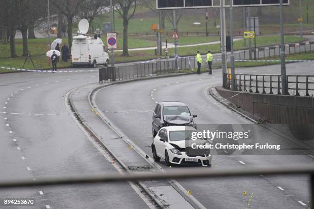 Police officers work at the scene of a multi-vehicle crash on Lee Bank Middleway, Edgbaston, in Birmingham, which left six people dead and a seventh...