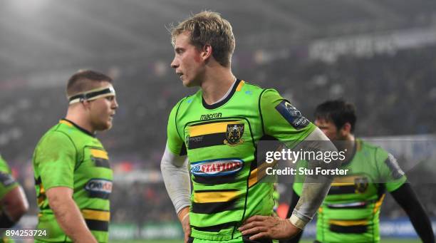 Saints fullback Harry Mallinder and team mates react after the Ospreys score their fourth try during the European Rugby Champions Cup match between...