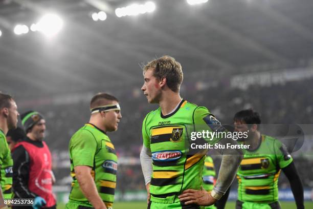 Saints fullback Harry Mallinder and team mates react after the Ospreys score their fourth try during the European Rugby Champions Cup match between...