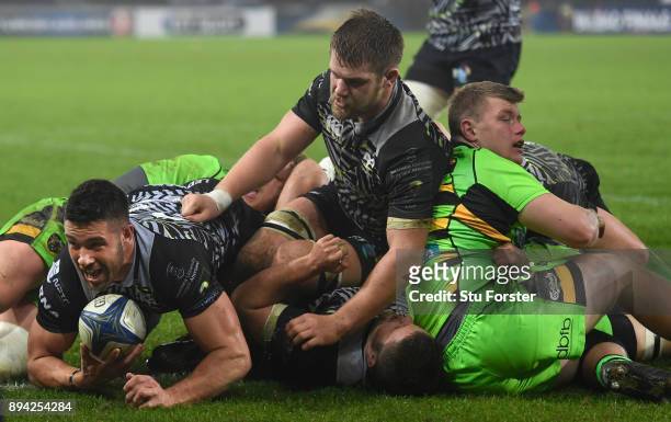 Ospreys player Rhys Webb dives over to score his second Ospreys try during the European Rugby Champions Cup match between Ospreys and Northampton...