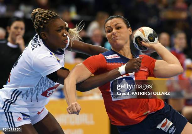 France's Kalidiatou Niakate and Norway's Nora Mork vie for the ball during the IHF Womens World Championship handball final match between France and...