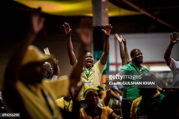 Delegates sing and dance during a plenary meeting at the NASREC Expo Centre during the 54th ANC national congress on December 17, 2017 in...