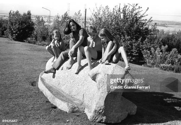 January 01, 1967. Madrid. Spain. The actress Lucia Bose in the garden of its house of Somosaguas, with its three children Lucia, Miguel and Paola.