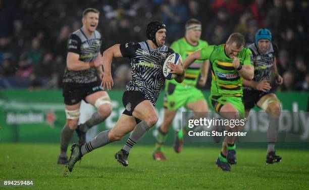 Ospreys fullback Dan Evans makes a break to set up the third try during the European Rugby Champions Cup match between Ospreys and Northampton Saints...