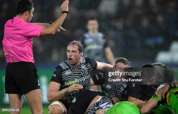 Ospreys captain Alun Wyn Jones speaks with the match referee Marius Mitrea during the European Rugby Champions Cup match between Ospreys and...