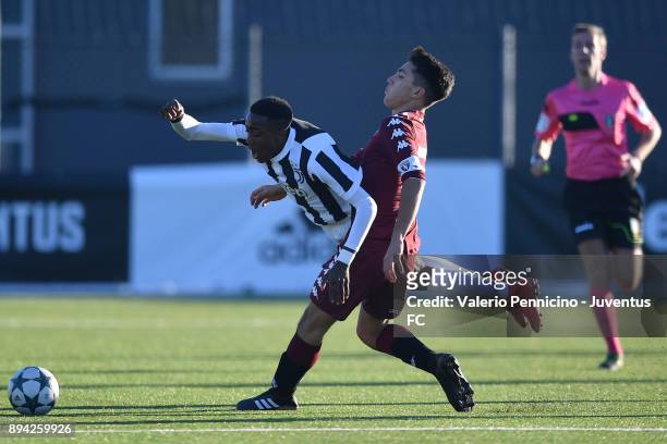 Franco Tongya of Juventus U16 is tackled during the match between Juventus U16 and Torino FC U16 at Juventus Center Vinovo on December 17, 2017 in...