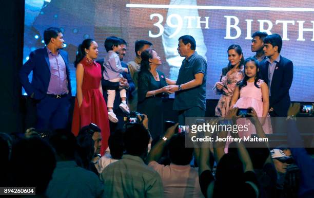 Boxer Manny Pacquiao is seen along with President Rodrigo Roa Duterte and his family as he celebrates his 39th birthday at KCC convention center on...